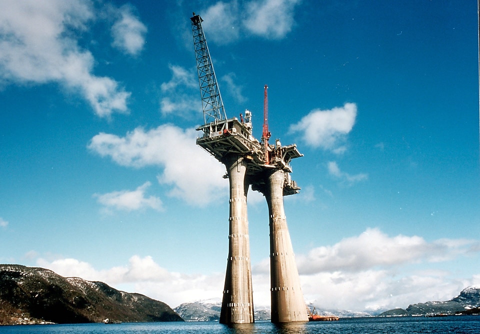 Large concrete natural gas platform with mounted cranes